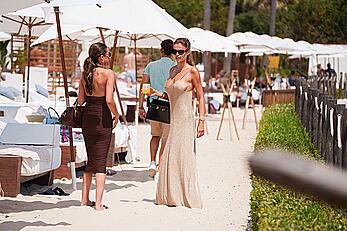 Brooks Nader sideboob while spotted having a drink at a beach club in Ibiza