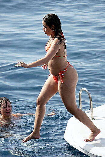 Camila Cabello shows her ass in orange bikini in Capri