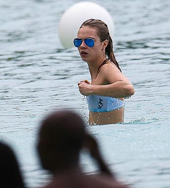 Cara Delevingne wearing a bikini at a beach in Barbados