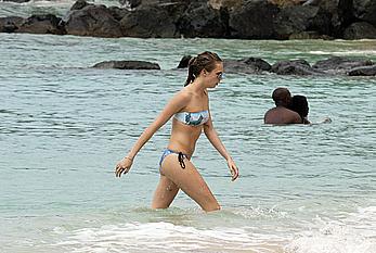 Cara Delevingne wearing a bikini at a beach in Barbados