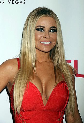 Carmen Electra cleavage in red dress at Grand Opening of Cherry Boom Boom at the Tropicana Las Vegas