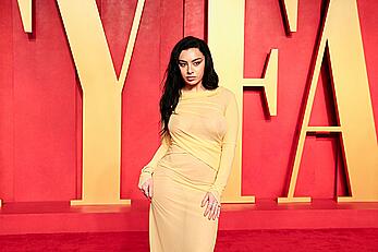 Charli XCX braless in see through dress at Vanity Fair Oscar Party in Beverly Hills