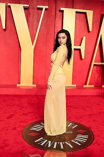 Charli XCX braless in see through dress at Vanity Fair Oscar Party in Beverly Hills