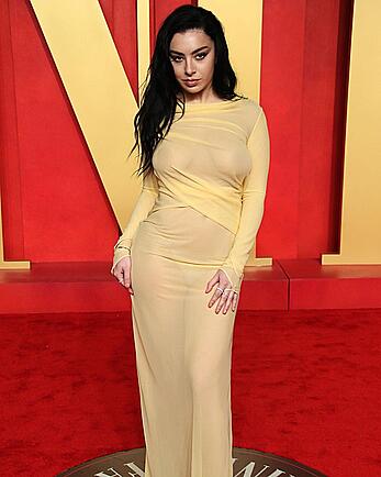 Charli XCX braless in see through dress at Vanity Fair Oscar Party in Beverly Hills