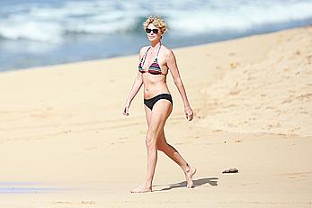 Charlize Theron sexy in bikini on a beach in Hawaii