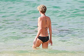 Charlize Theron sexy in bikini on a beach in Hawaii