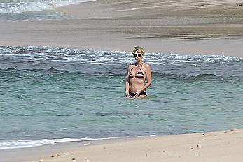 Charlize Theron sexy in bikini on a beach in Hawaii