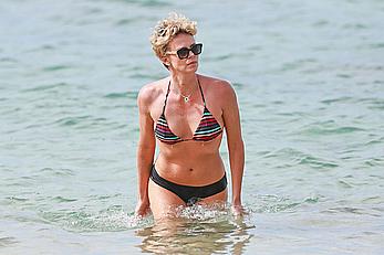 Charlize Theron sexy in bikini on a beach in Hawaii