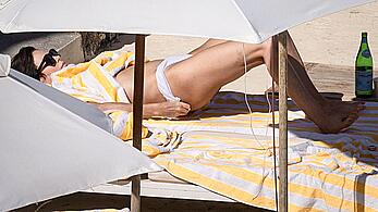 Charlize Theron sunbathing topless in Tuscany