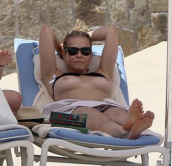 Chelsea Handler sunbathing topless at a beach in Mexico