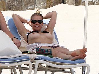 Chelsea Handler sunbathing topless at a beach in Mexico