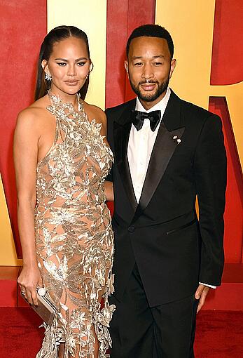 Chrissy Teigen in see through dress at Vanity Fair Oscar Party in Beverly Hills