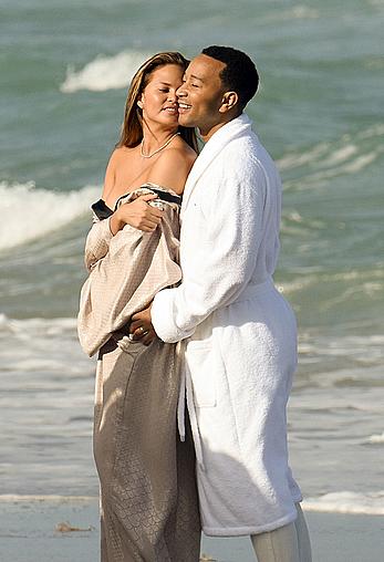 Chrissy Teigen topless during photoshoot at Miami Beach