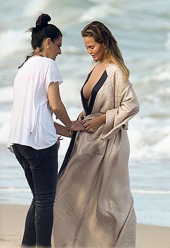 Chrissy Teigen topless during photoshoot at Miami Beach