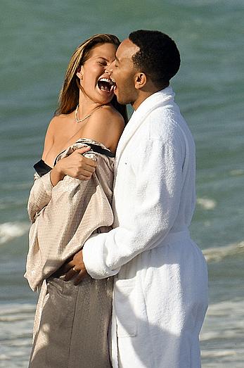 Chrissy Teigen topless during photoshoot at Miami Beach