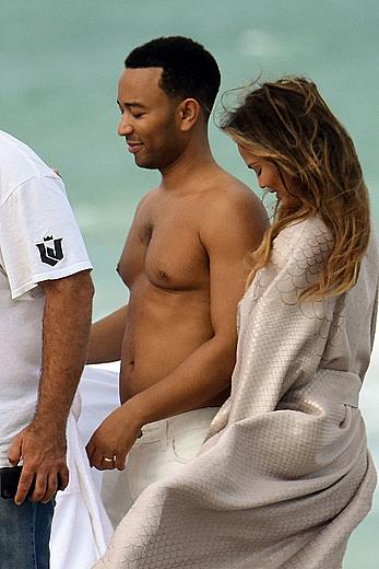 Chrissy Teigen topless during photoshoot at Miami Beach