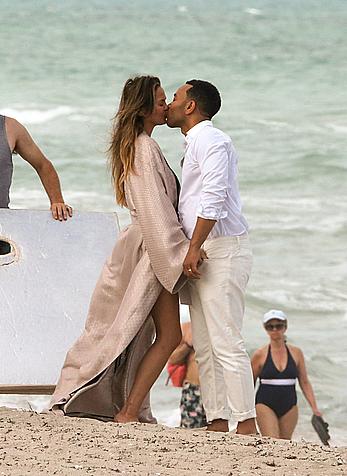 Chrissy Teigen topless during photoshoot at Miami Beach