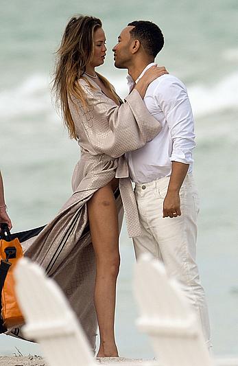 Chrissy Teigen topless during photoshoot at Miami Beach