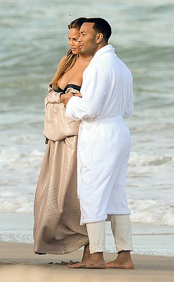 Chrissy Teigen topless during photoshoot at Miami Beach