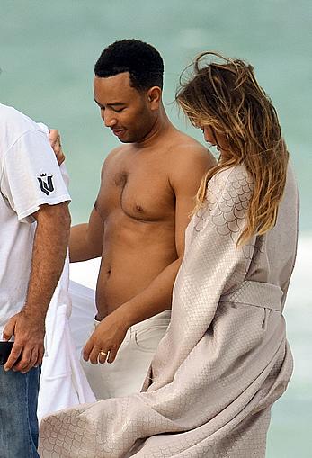 Chrissy Teigen topless during photoshoot at Miami Beach