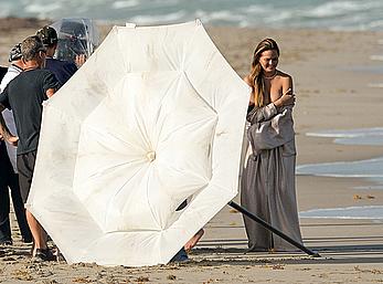 Chrissy Teigen topless during photoshoot at Miami Beach