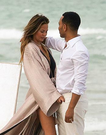 Chrissy Teigen topless during photoshoot at Miami Beach