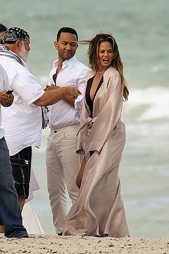 Chrissy Teigen topless during photoshoot at Miami Beach