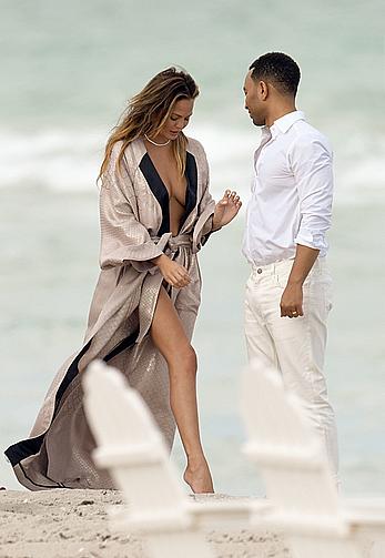 Chrissy Teigen topless during photoshoot at Miami Beach