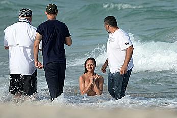 Chrissy Teigen topless during photoshoot at Miami Beach