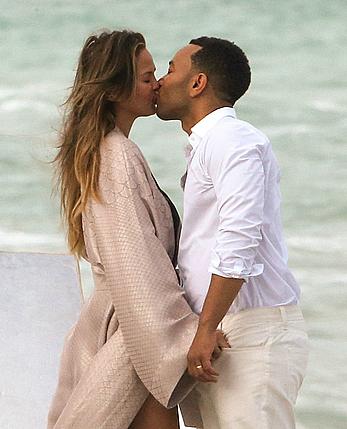 Chrissy Teigen topless during photoshoot at Miami Beach