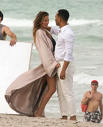 Chrissy Teigen topless during photoshoot at Miami Beach