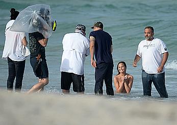 Chrissy Teigen topless during photoshoot at Miami Beach