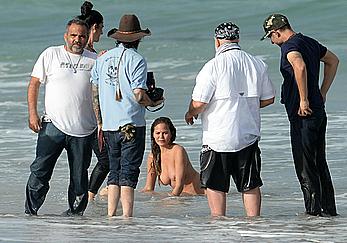 Chrissy Teigen topless during photoshoot at Miami Beach