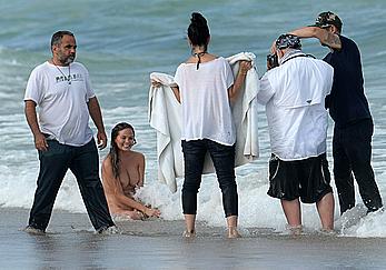 Chrissy Teigen topless during photoshoot at Miami Beach