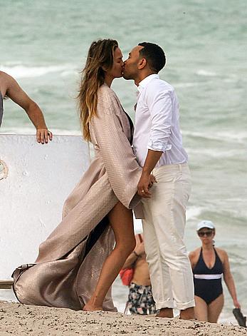 Chrissy Teigen topless during photoshoot at Miami Beach