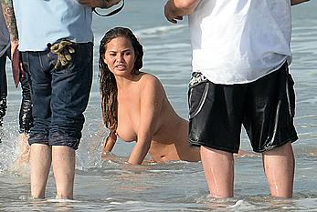 Chrissy Teigen topless during photoshoot at Miami Beach