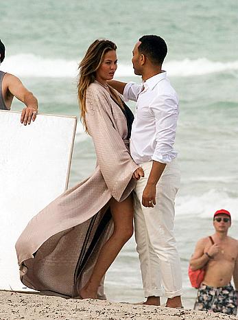 Chrissy Teigen topless during photoshoot at Miami Beach