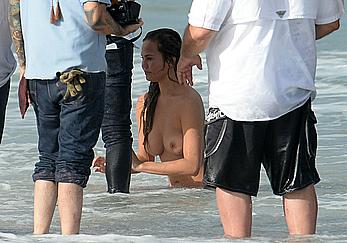 Chrissy Teigen topless during photoshoot at Miami Beach