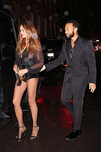 Chrissy Teigen see through to tits and long legs at The Polo Bar in NY