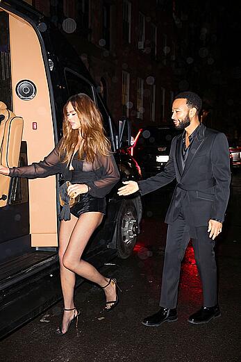 Chrissy Teigen see through to tits and long legs at The Polo Bar in NY