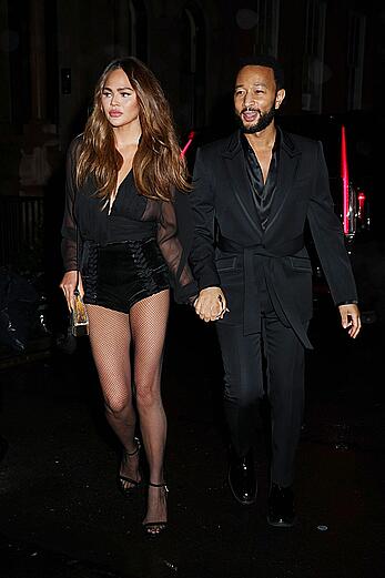 Chrissy Teigen see through to tits and long legs at The Polo Bar in NY