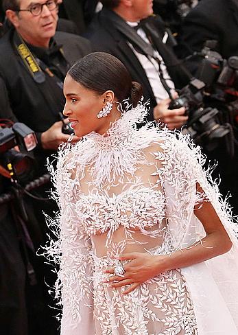 Cindy Bruna in white see through dress at Burning premiere in Cannes