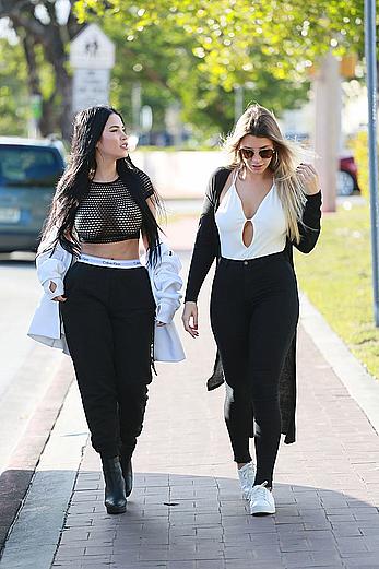 Claudia Alende in see through top taking a walk