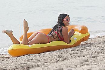 Claudia Romani in red bikini on a beach in Miami