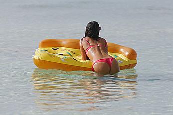 Claudia Romani in red bikini on a beach in Miami