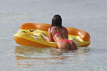 Claudia Romani in red bikini on a beach in Miami