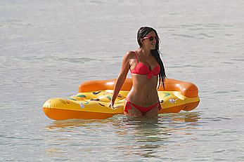 Claudia Romani in red bikini on a beach in Miami