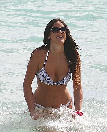 Claudia Romani cameltoe and cleavage in white bikini at the beach in Miami