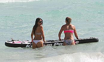 Claudia Romani cameltoe and cleavage in white bikini at the beach in Miami