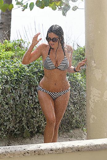 Claudia Romani taking a shower in a bikini in Miami